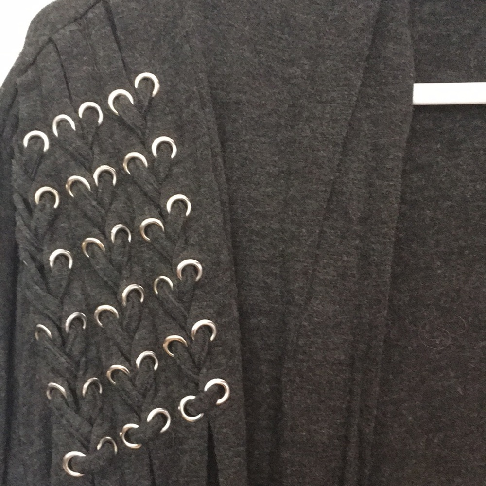 Dark gray open sweater.